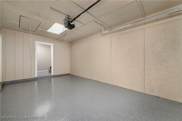 105 N Circle B, Roland, OK 74954 - garage featuring a garage door opener and a decorative wall