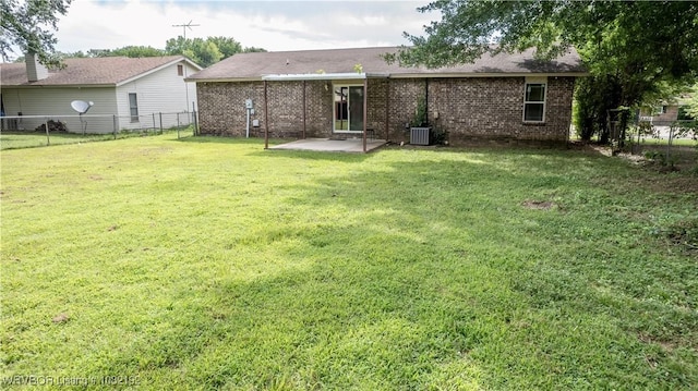 105 N Circle B, Roland, OK 74954 - rear view of house with a patio, a fenced backyard, and brick siding