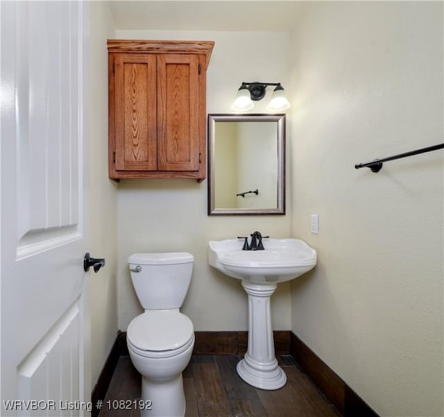 105 N Circle B, Roland, OK 74954 - bathroom featuring baseboards and wood finished floors