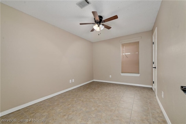 105 N Circle B, Roland, OK 74954 - unfurnished room featuring a ceiling fan and light tile patterned floors