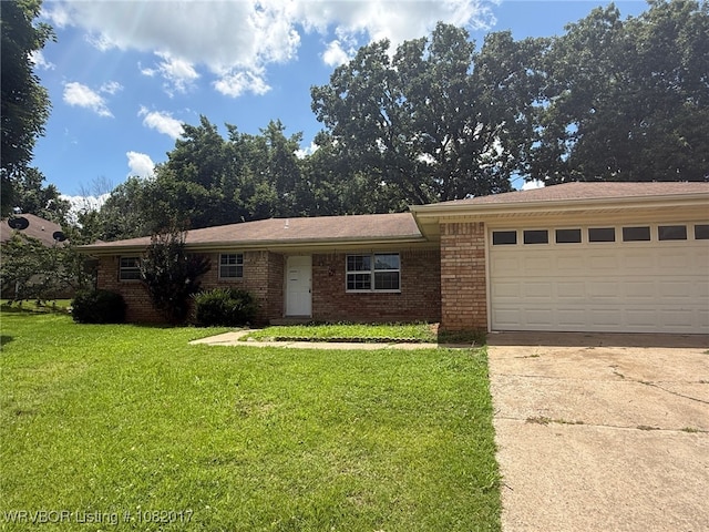 403 Woodland Hills Blvd, Roland, OK 74954 - view of front facade featuring driveway, brick siding, a front yard, and an attached garage