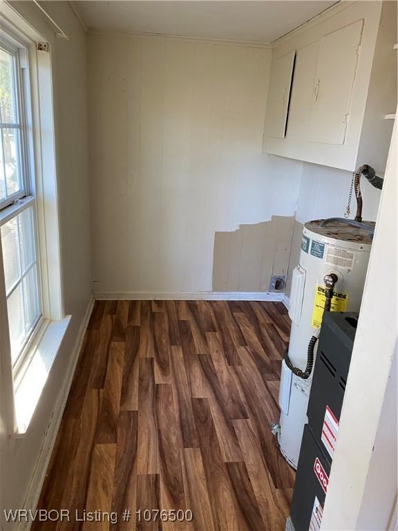 kitchen with dark hardwood / wood-style flooring and white cabinetry