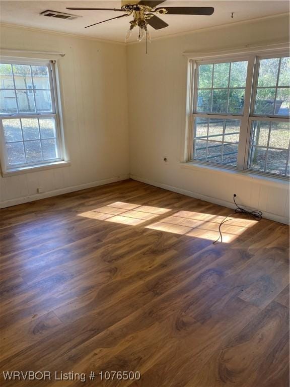 unfurnished room with crown molding, ceiling fan, and dark hardwood / wood-style floors