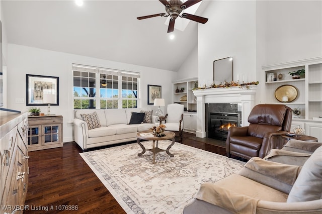 living room with ceiling fan, dark hardwood / wood-style flooring, and high vaulted ceiling