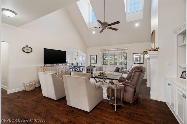 living room with dark hardwood / wood-style flooring, high vaulted ceiling, and ceiling fan