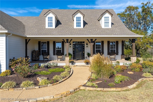 cape cod-style house featuring a porch