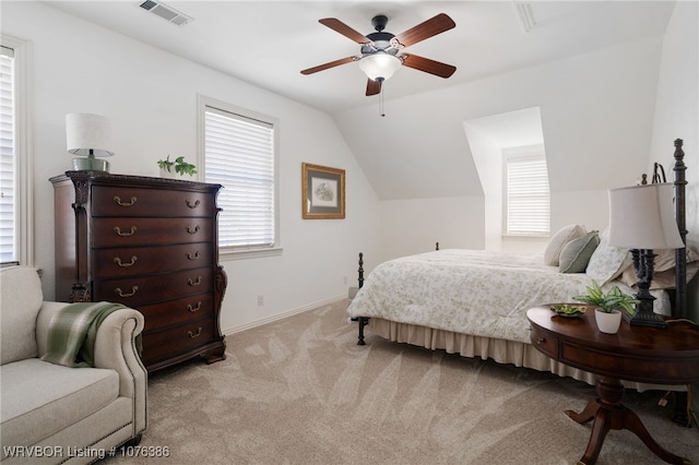 bedroom with ceiling fan, lofted ceiling, and light carpet