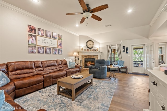 2110 Parkway Cir, Van Buren, AR 72956 - living area with a ceiling fan, wood finished floors, recessed lighting, a warm lit fireplace, and lofted ceiling