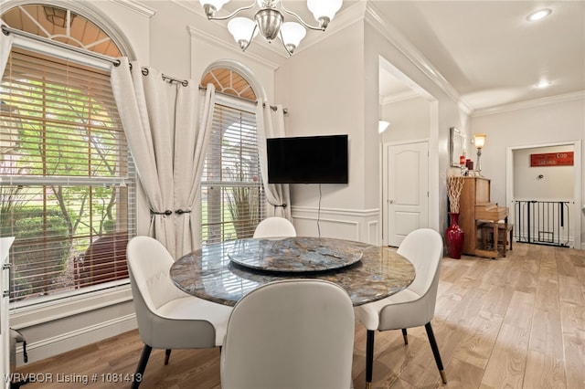 2110 Parkway Cir, Van Buren, AR 72956 - dining room with a chandelier, ornamental molding, and light wood-type flooring