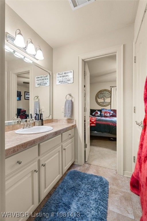 2110 Parkway Cir, Van Buren, AR 72956 - bathroom featuring ensuite bathroom, vanity, and tile patterned flooring