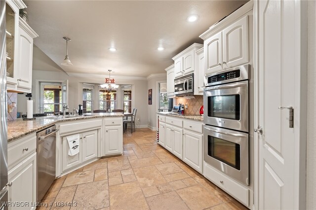 2110 Parkway Cir, Van Buren, AR 72956 - kitchen featuring stainless steel appliances, stone tile floors, tasteful backsplash, crown molding, and a sink