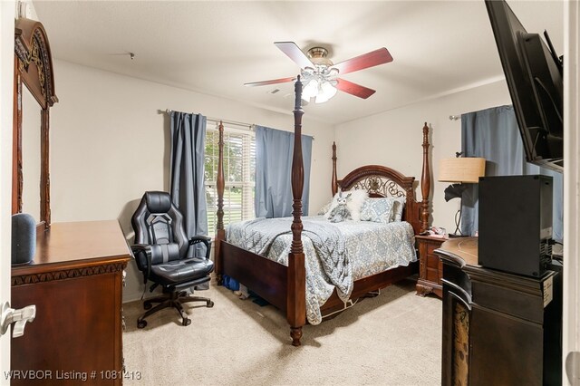 2110 Parkway Cir, Van Buren, AR 72956 - bedroom featuring light carpet, ceiling fan, and a desk