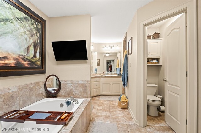 2110 Parkway Cir, Van Buren, AR 72956 - bathroom with vanity, toilet, and a garden tub