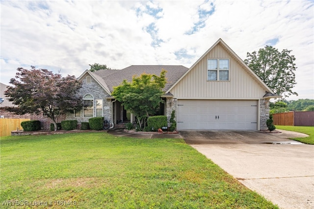2110 Parkway Cir, Van Buren, AR 72956 - traditional-style house with stone siding, concrete driveway, and a garage