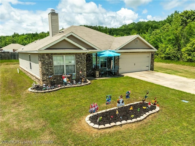 2005 Scarlet Oak Dr, Van Buren, AR 72956 - view of front facade with concrete driveway, a front lawn, a garage, brick siding, and a chimney