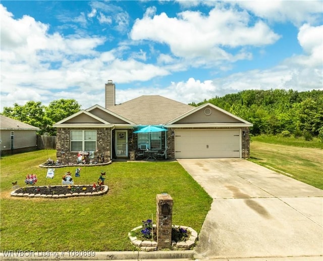 2005 Scarlet Oak Dr, Van Buren, AR 72956 - view of front of property featuring a front yard, a garage, driveway, and a chimney