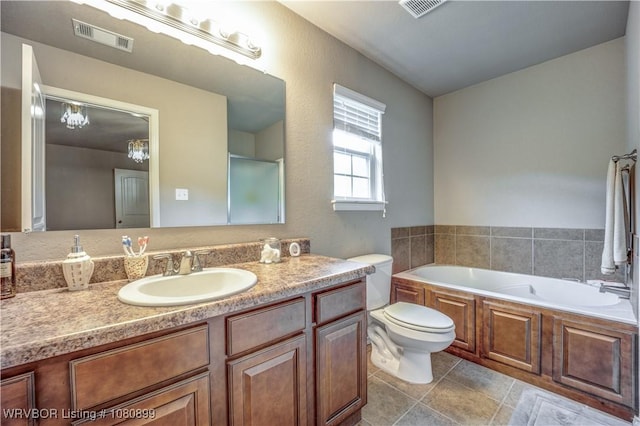 2005 Scarlet Oak Dr, Van Buren, AR 72956 - full bathroom featuring a garden tub, vanity, toilet, a chandelier, and tile patterned flooring