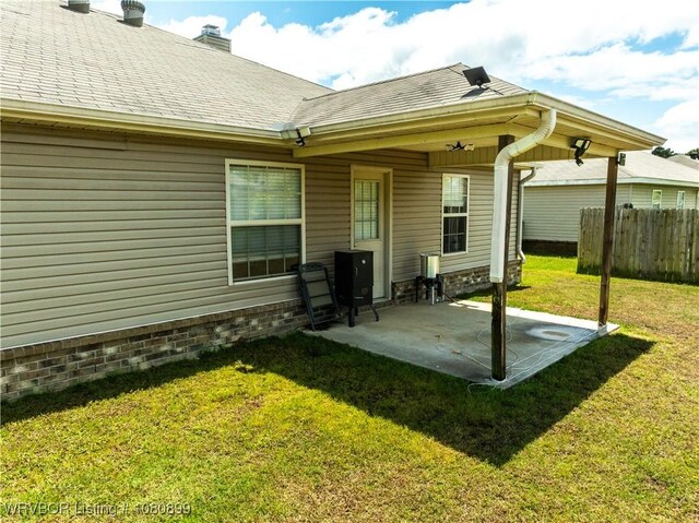2005 Scarlet Oak Dr, Van Buren, AR 72956 - back of house with a patio area, a chimney, and roof with shingles