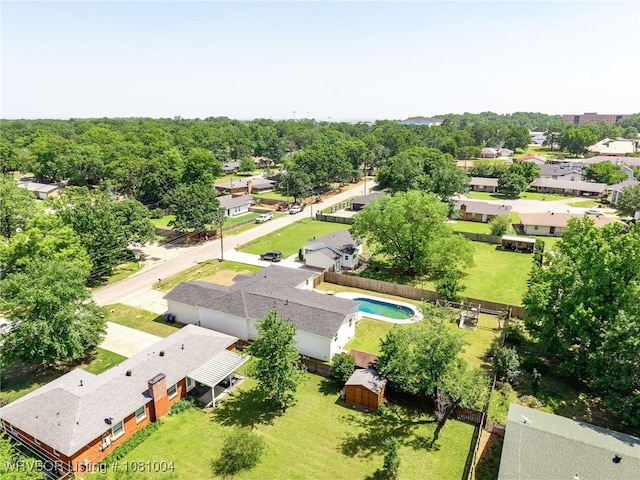 aerial view of residential area featuring a pool