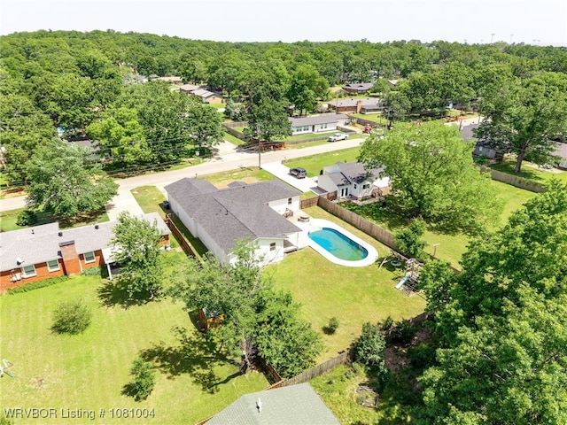 aerial view of residential area featuring a pool