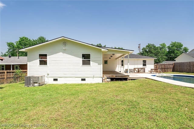 back of house featuring crawl space, cooling unit, and a deck