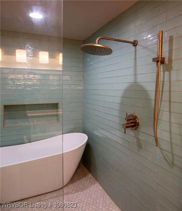 6001 Bolton Rd, Fort Smith, AR 72903 - bathroom with tile patterned flooring, a tile shower, a soaking tub, and tile walls