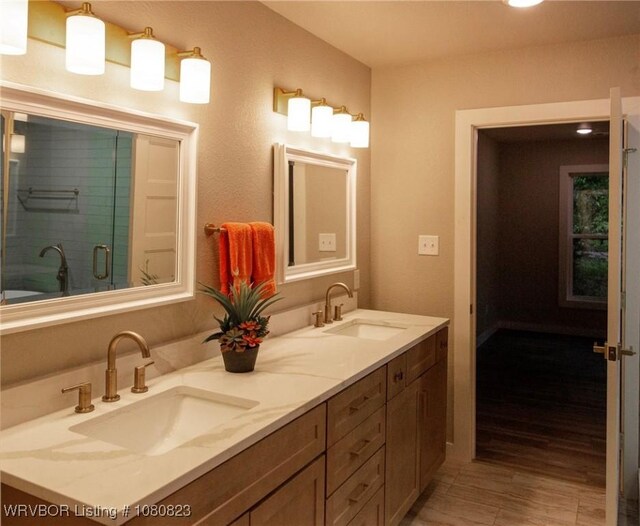 6001 Bolton Rd, Fort Smith, AR 72903 - bathroom featuring double vanity, recessed lighting, and wood finished floors