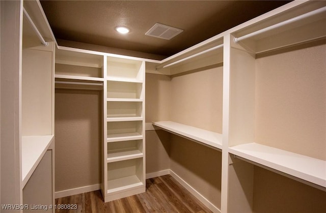 6001 Bolton Rd, Fort Smith, AR 72903 - walk in closet featuring wood finished floors