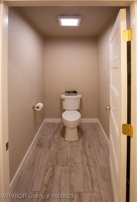 6001 Bolton Rd, Fort Smith, AR 72903 - bathroom featuring toilet and baseboards
