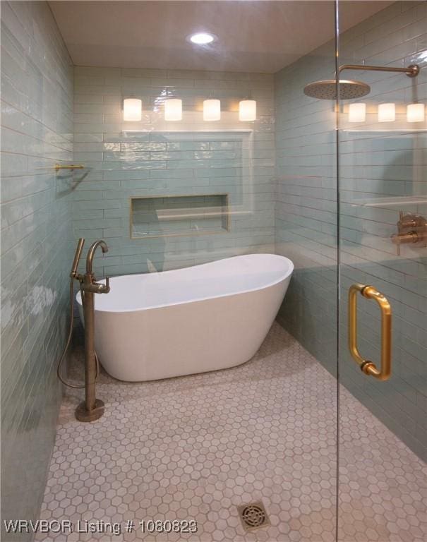 6001 Bolton Rd, Fort Smith, AR 72903 - full bath with tile walls, a tile shower, tile patterned flooring, and a freestanding tub