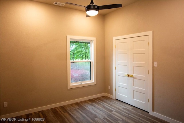 6001 Bolton Rd, Fort Smith, AR 72903 - unfurnished room featuring a ceiling fan, dark wood finished floors, and baseboards