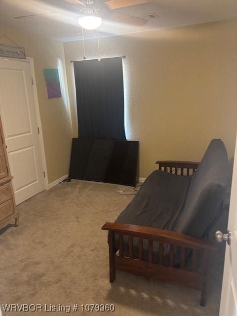 bedroom featuring ceiling fan, carpet flooring, and baseboards