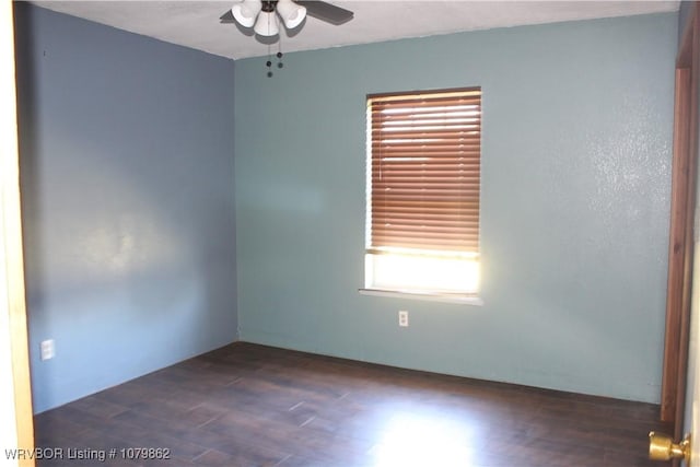 spare room featuring a ceiling fan and wood finished floors