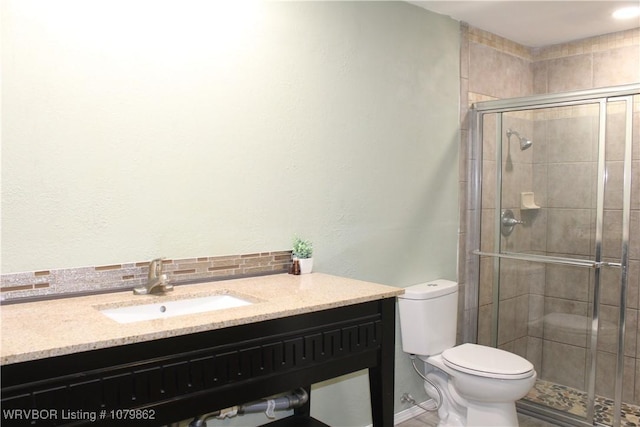 full bath with toilet, a stall shower, and vanity