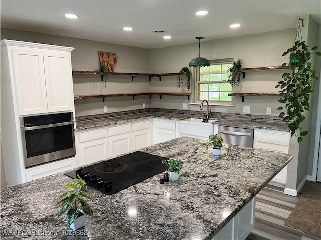 1611 Kimberling Hill Dr, Alma, AR 72921 - kitchen with open shelves, stainless steel appliances, white cabinetry, wood finished floors, and recessed lighting