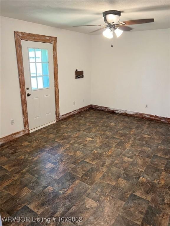 1611 Kimberling Hill Dr, Alma, AR 72921 - empty room featuring a ceiling fan and baseboards