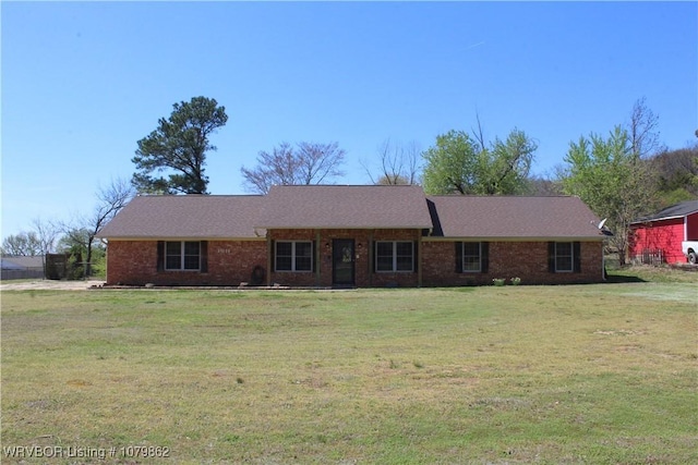 ranch-style home with a front lawn and brick siding