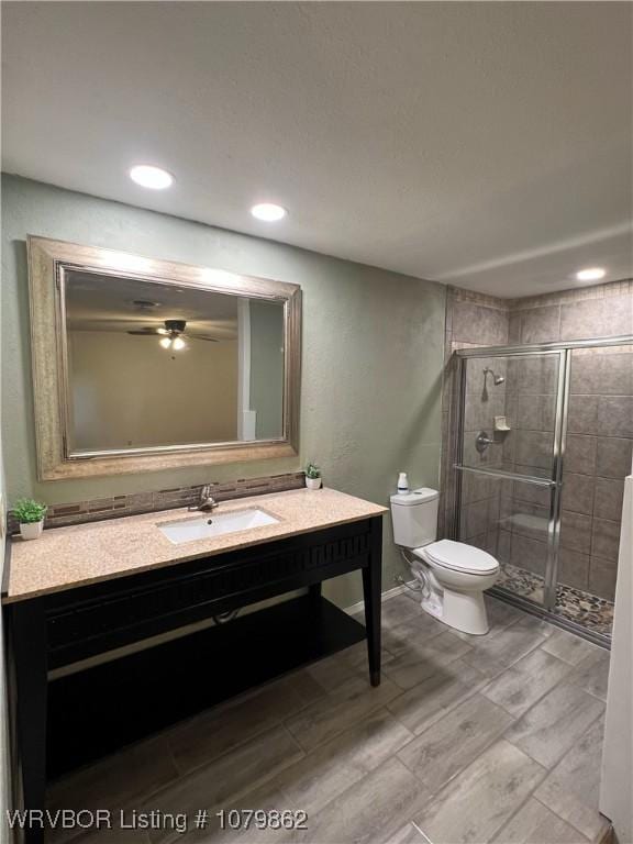 1611 Kimberling Hill Dr, Alma, AR 72921 - bathroom featuring a shower stall, vanity, recessed lighting, and wood tiled floors