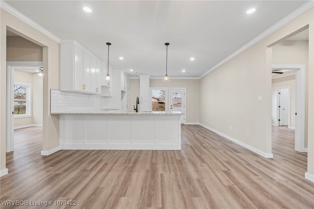 3115 Spradling Ave, Fort Smith, AR 72904 - kitchen featuring plenty of natural light, light wood-style floors, a ceiling fan, white cabinetry, and recessed lighting