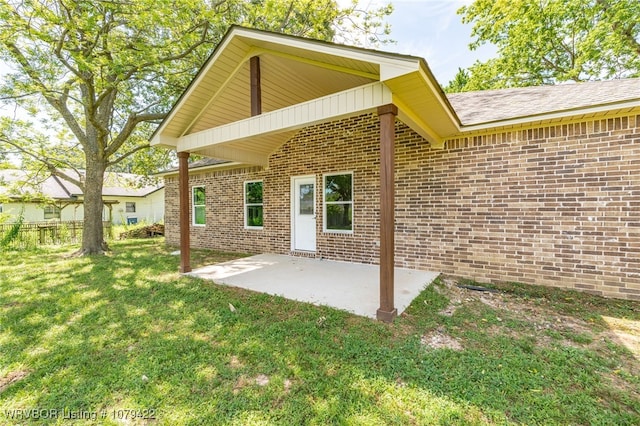 3115 Spradling Ave, Fort Smith, AR 72904 - back of property featuring brick siding, a yard, and a patio area
