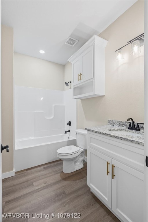 3115 Spradling Ave, Fort Smith, AR 72904 - full bathroom featuring vanity, shower / bath combination, wood finished floors, and recessed lighting
