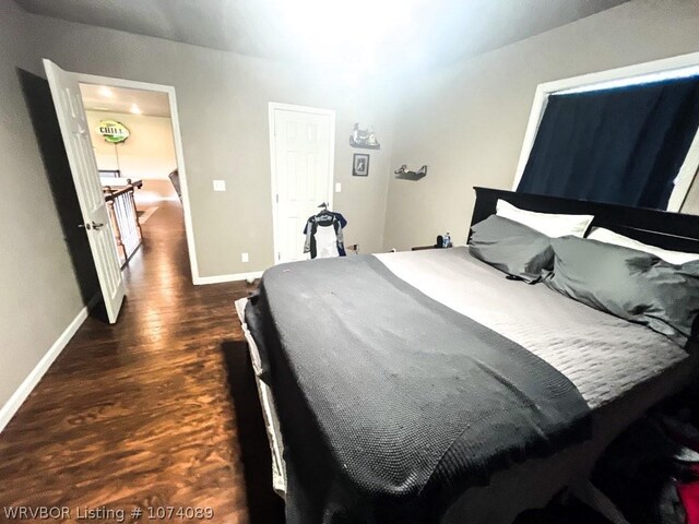 bedroom featuring dark hardwood / wood-style flooring