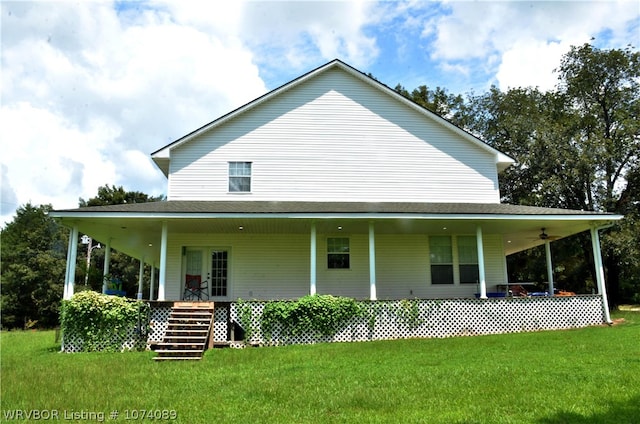 back of property with a lawn