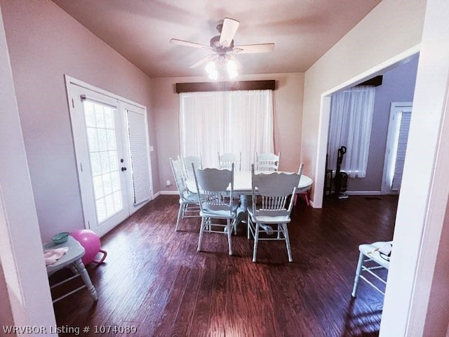 dining area featuring ceiling fan, dark hardwood / wood-style flooring, and french doors