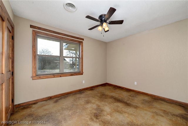 unfurnished room featuring visible vents, baseboards, and concrete flooring