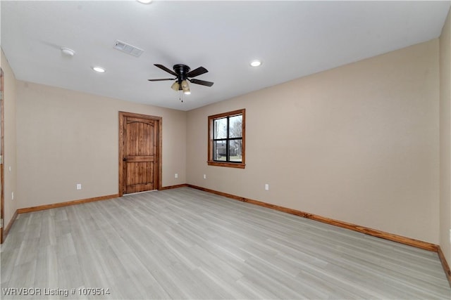 spare room featuring visible vents, light wood-style flooring, a ceiling fan, recessed lighting, and baseboards