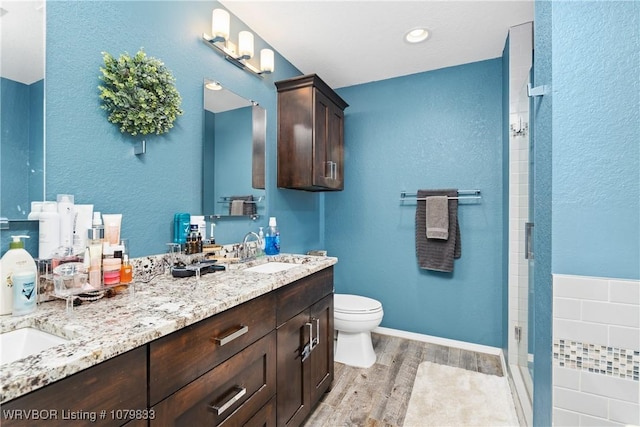 298 Bayou Rd, Fort Gibson, OK 74434 - full bath featuring toilet, a sink, wood finished floors, walk in shower, and double vanity