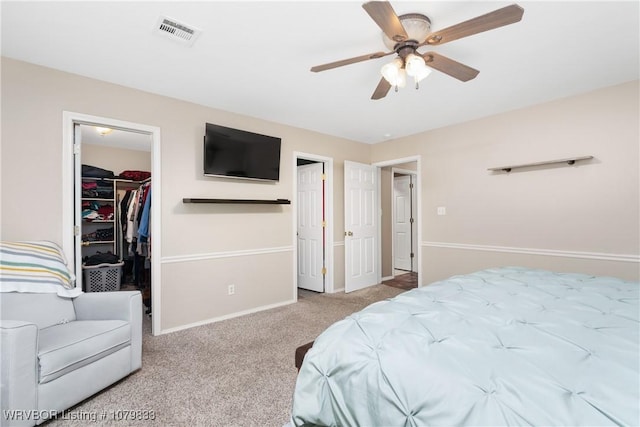 298 Bayou Rd, Fort Gibson, OK 74434 - bedroom featuring a closet, a walk in closet, baseboards, visible vents, and carpet