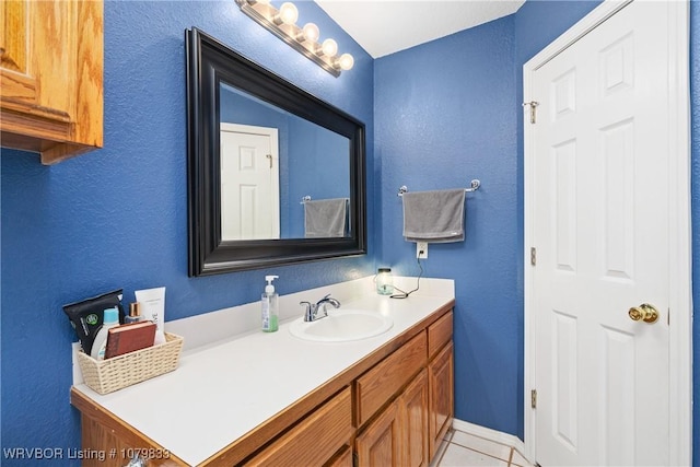 298 Bayou Rd, Fort Gibson, OK 74434 - bathroom featuring tile patterned floors, vanity, and a textured wall