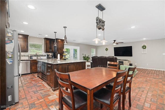 298 Bayou Rd, Fort Gibson, OK 74434 - dining area with baseboards, brick floor, recessed lighting, and a ceiling fan